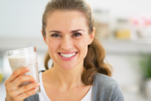 woman drinking smoothie