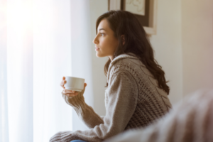 woman in home thinking